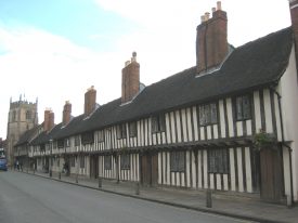 Church Street Almshouse, Grammar School & Guild Chapel, Stratford upon Avon. Timber-framed row of buildings, with a jetted upper storey | Image courtesy of Anne Langley