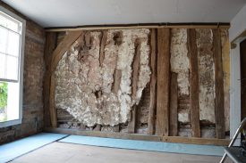 33 West Street also has exposed framing inside, particularly in the party wall with No. 31. | Photo reproduced by kind permission of Archaeology Warwickshire.