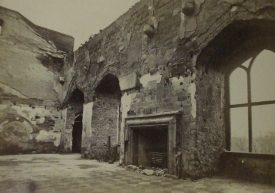Warwick Castle's Great Hall after the fire. | From an account of the fire at Warwick Castle, with articles and photographs arranged by H.T.Cooke & Son. Warwickshire County Record Office reference PH 595.