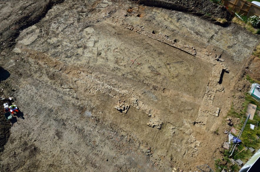 Aerial view of the tithe barn remains. | Image reproduced by permission of Aerial-Cam Ltd.