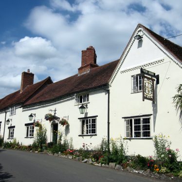 White painted pub made up of a row of three cottages | Image courtesy of Anne Langley