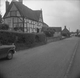 The house in 1967. The roof has a cloth-like texture. | Warwickshire County Record Office reference PH(N)212/56/1/49. Part of a photographic survey of Warwickshire parishes conducted by the Women's Institute.