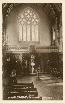 This photograph shows the interior of the chapel of St Mary's Priory, Princethorpe, looking at the carved masonry window in the west wall. | Image courtesy of Princethorpe College