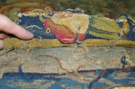 Hidden secrets of the Sheldon Tapestry - a fragment of the original border, showing pears. | Photo courtesy of Warwickshire Museum