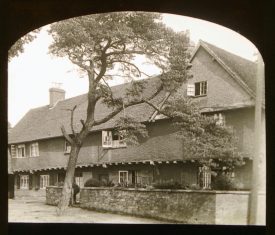 House with jetted 2nd storey covered in render with pine tree in front | Courtesy of Warwickshire CC, Rugby Library Local Studies Collection; WCRO PH827/5/33; photographer Rev. E. Dew