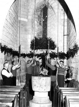 Bell-ringers by the font in Cubbington parish church. Left-right: Spencer Hicks, Arthur Hickman, Alan Rose, Ernie Taylor, Walter Levy. 1950s. | Warwickshire County Record Office reference PH(D)921/19