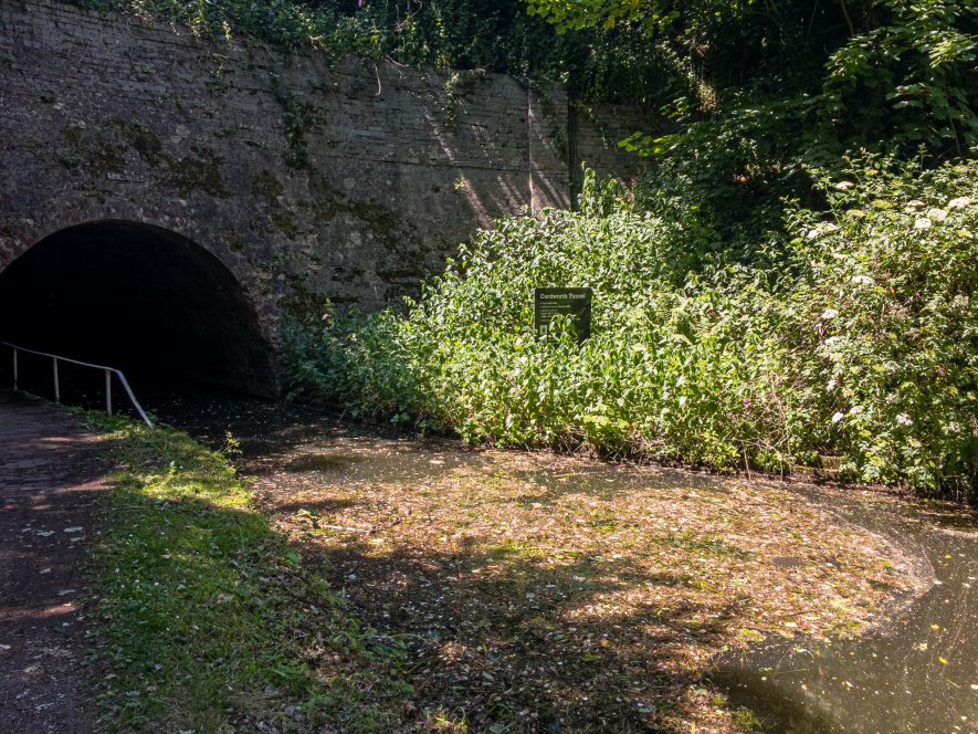 River/canal curves round to the left under canal bridge, with footpath on left hand side | Image courtesy of Kev Baldry
