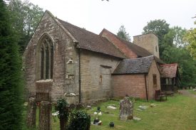 Country church with redbrick extension around porch area