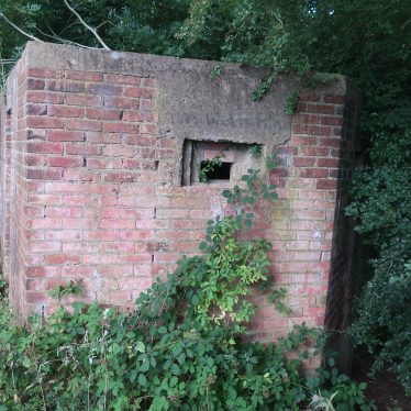 World War Two red brick pillbox, with overhanging trees | Image courtesy of Gary Stocker