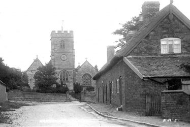 Harborough Magna.  Church and row of terraced houses