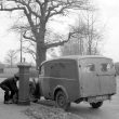 Leamington Spa.  Postman collecting mail