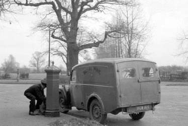 Leamington Spa.  Postman collecting mail