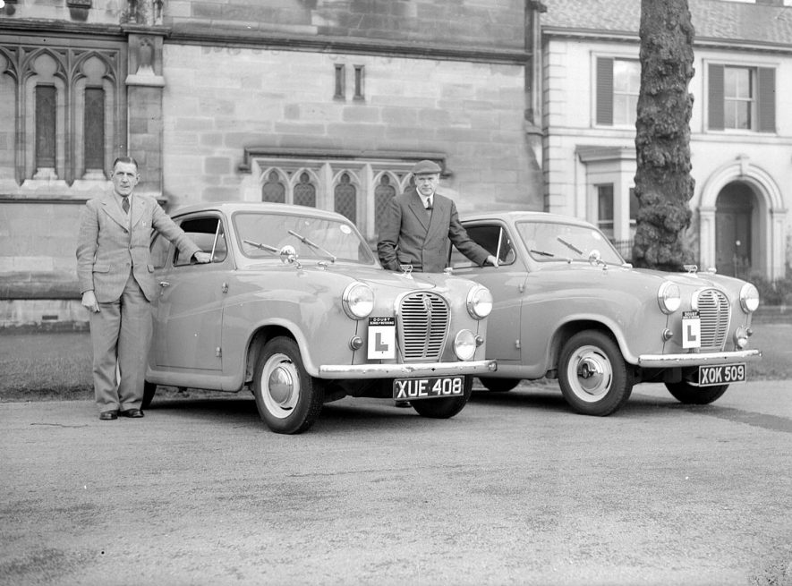 Doust School of Motoring showing cars and instructors, The Parade, Leamington Spa.  1959 |  IMAGE LOCATION: (Warwickshire County Record Office)
