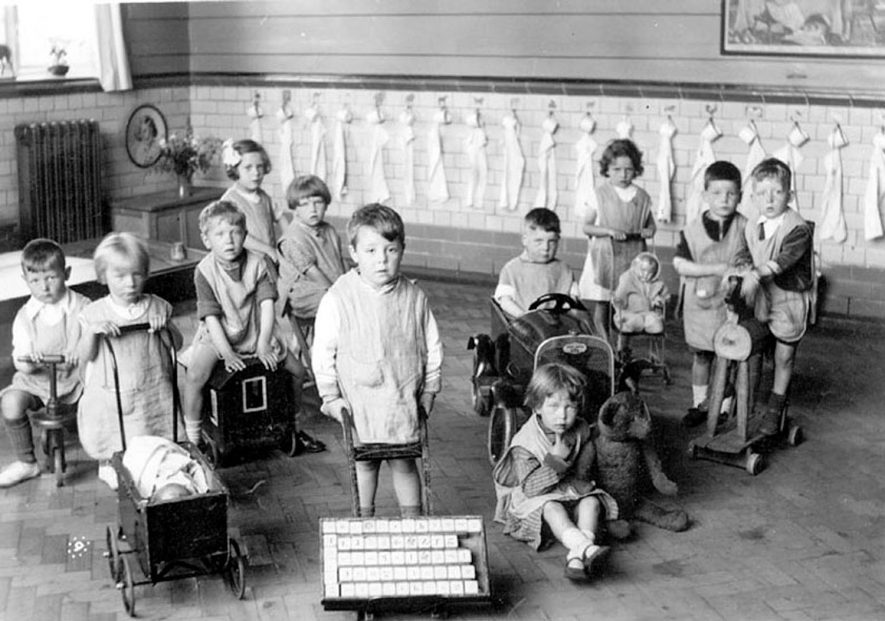 George Street Infants' School nursery class, Bedworth. Pupils posing with toys.  1930s |  IMAGE LOCATION: (Warwickshire County Record Office)