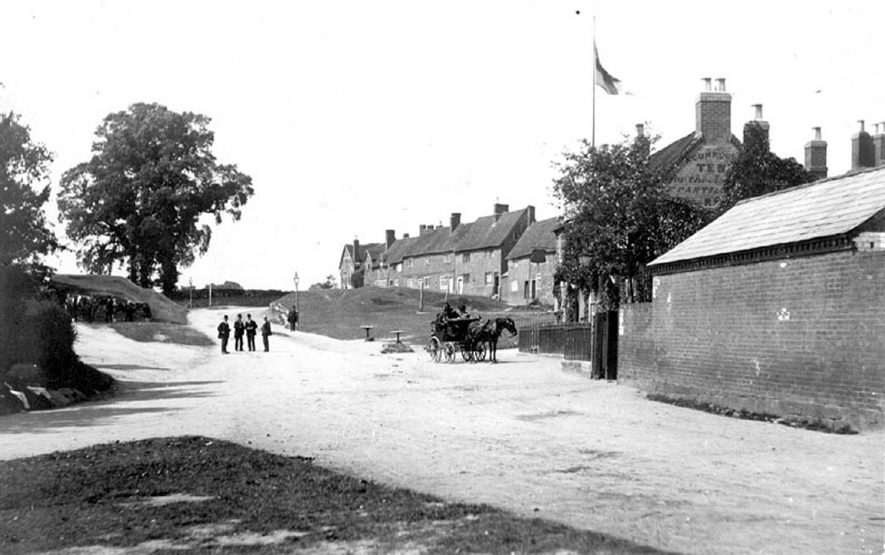 Cottages on Castle Green, Kenilworth with pony and trap in foreground.  1900s |  IMAGE LOCATION: (Warwickshire County Record Office)