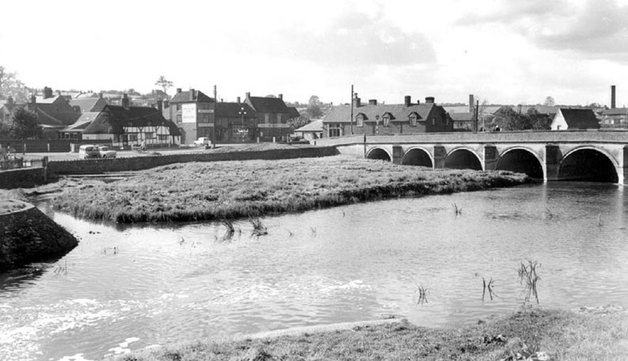 River bridge and village from the footbridge. Polesworth.  1960s |  IMAGE LOCATION: (Warwickshire County Record Office)