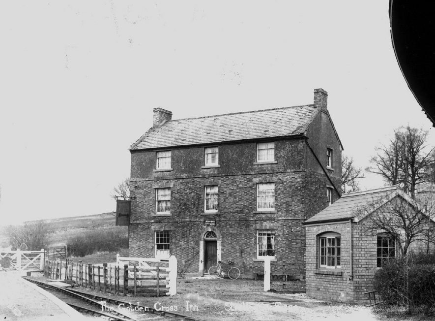 Stretton on Fosse. The Golden Cross Inn beside railway and level crossing.  1900s |  IMAGE LOCATION: (Warwickshire County Record Office)