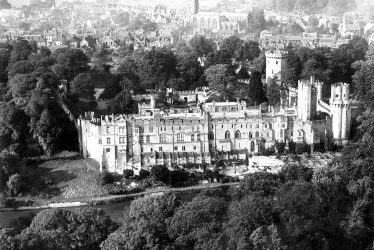 Warwick.  Aerial view of Castle and town