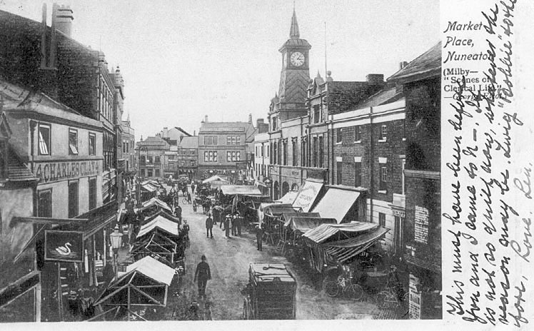 Market stalls and shops in Market Place, Nuneaton.  1900s |  IMAGE LOCATION: (Warwickshire County Record Office)