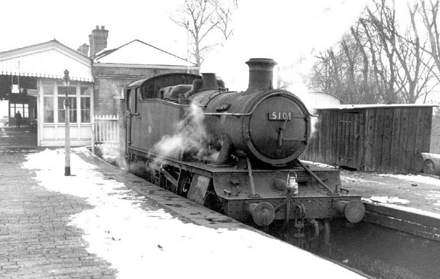 Warwick Station with steam engine. The loco used for assisting freight trains up Hatton Bank, in a siding. Engine no. G.W.R. 2-6-2 tank no. 5101.  1960 |  IMAGE LOCATION: (Warwickshire County Record Office)