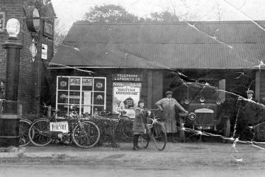 Lapworth.  Daimler car outside garage