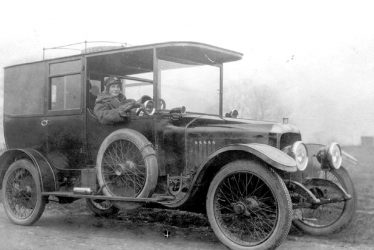 Moreton Morrell.  Lady at the wheel of a motor car