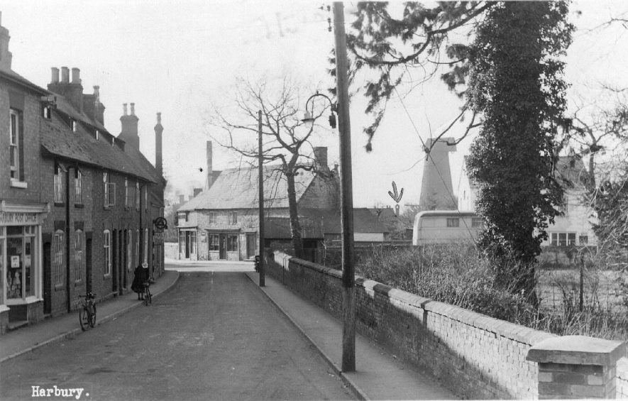 Church Street, Harbury looking towards the wind mill showing the post office, bank and shops.  1950s |  IMAGE LOCATION: (Warwickshire County Record Office)