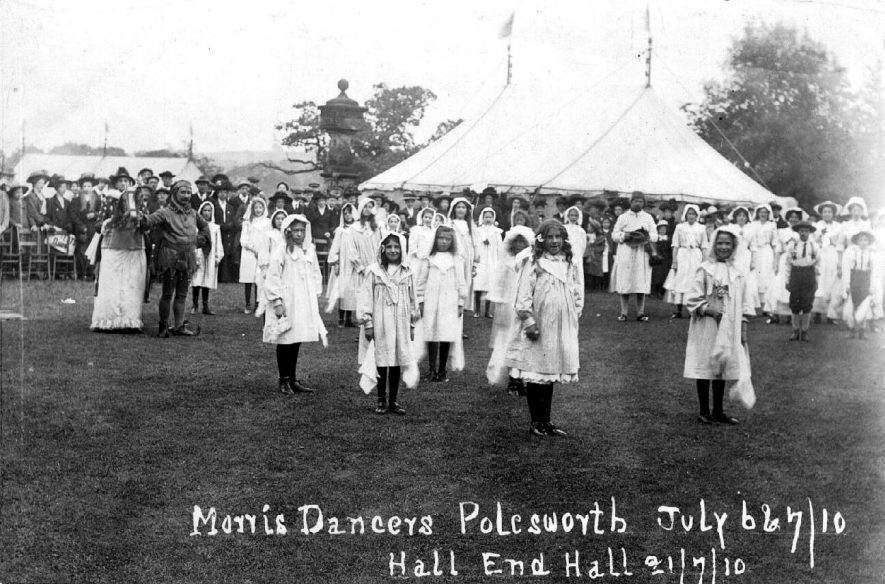 Morris dancers at Hall End Hall, Polesworth. The children carrying handkerchiefs.  There is a jester on the left with a hobby horse.  1910 |  IMAGE LOCATION: (Warwickshire County Record Office)