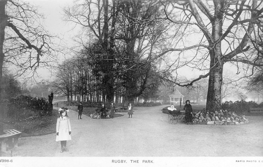 Caldecott Park, Rugby, with bandstand in the background.  1900s |  IMAGE LOCATION: (Warwickshire County Record Office)
