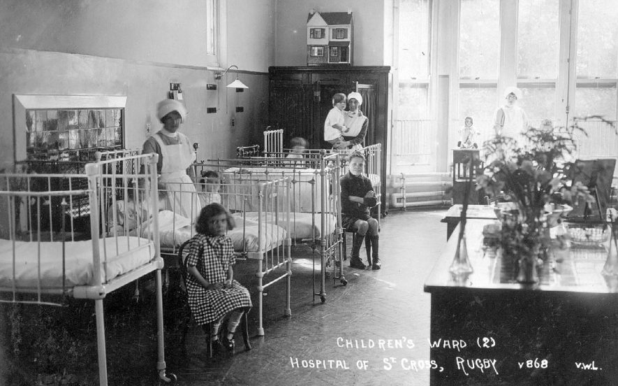 Interior of the children's ward at St Cross Hospital, Rugby.  1920s |  IMAGE LOCATION: (Warwickshire County Record Office)