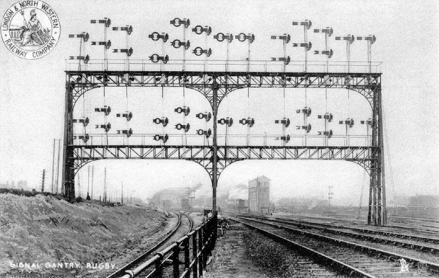 Railway signal gantry at old station, Rugby, after it had been duplicated with sky arms in readiness for the construction of the viaduct carrying the new Great Central Railway London Extension. Trademark, top left,  