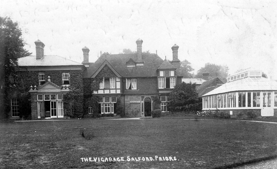 The Vicarage and its gardens, showing the French windows opening onto the lawn.  1910s |  IMAGE LOCATION: (Warwickshire County Record Office)