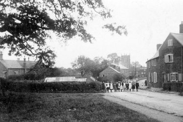 Shilton.  Children standing in the street