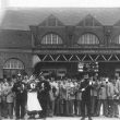 Rugby.  Band in fancy dress outside Railway Station
