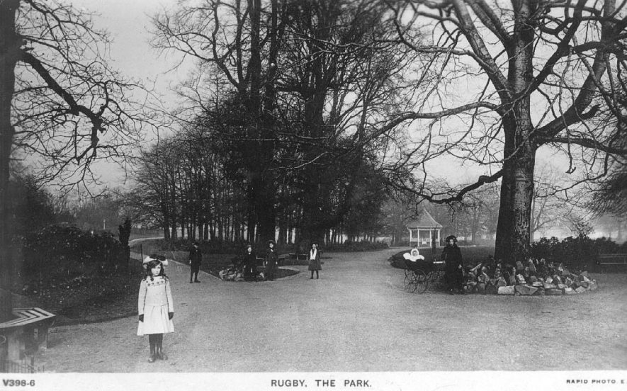 Caldecott Park, Rugby. A girl is standing in the foreground of the picture.  1900s |  IMAGE LOCATION: (Warwickshire County Record Office)