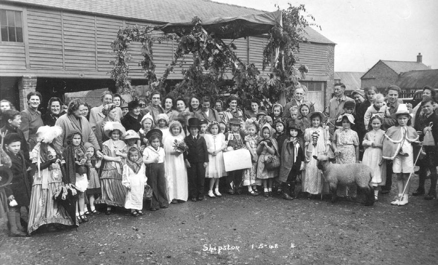 Group of children in fancy dress celebrating May Day in Shipston on Stour.  May 1st 1951 |  IMAGE LOCATION: (Warwickshire County Record Office)