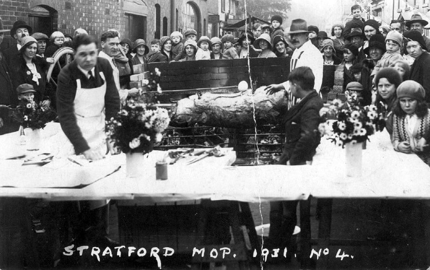 Pig-roast at the Stratford Mop.  1931 |  IMAGE LOCATION: (Warwickshire County Record Office)