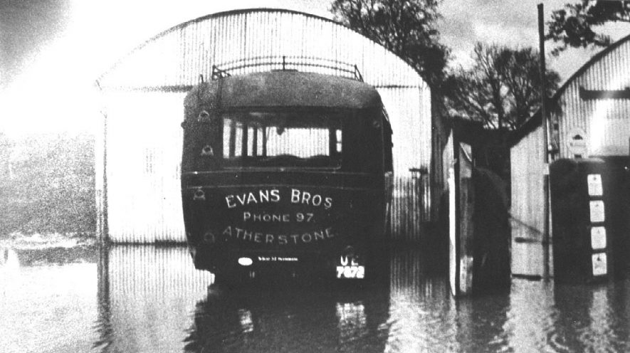 Evans Bros. de Luxe Ltd. Bus parked by shed, Atherstone.  1932 |  IMAGE LOCATION: (Atherstone Library)