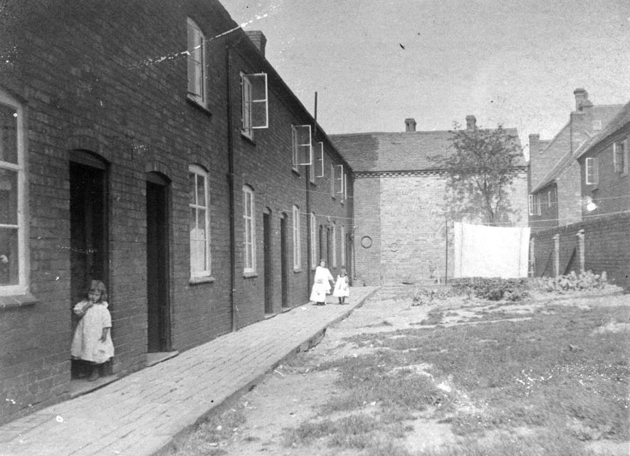 Vero's Terrace, Woodman Yard on right towards Long Street, Atherstone.  Building behind tree is a post 1888 pre 1910 addition.  1900s |  IMAGE LOCATION: (Warwickshire County Record Office)