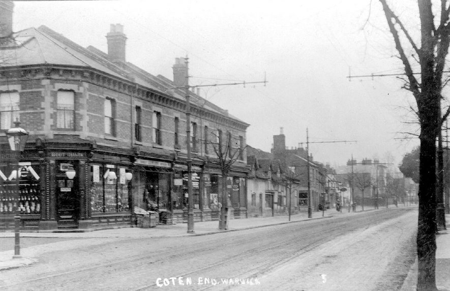 Shops in Coten End, Warwick with Wridgway's boot and shoe shop in the foreground.  Circa 1905 |  IMAGE LOCATION: (Warwickshire County Record Office)