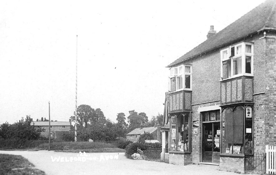 Village stores and maypole in Welford on Avon.  1910s |  IMAGE LOCATION: (Warwickshire County Record Office)