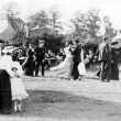 Stockton.  Dancing to a uniformed brass band