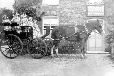 Whichford.  New Inn, children outside