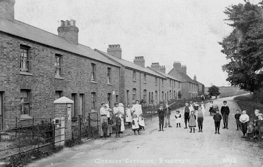 'Greaves Cottages' Stockton with children standing outside.  1900s |  IMAGE LOCATION: (Warwickshire County Record Office)