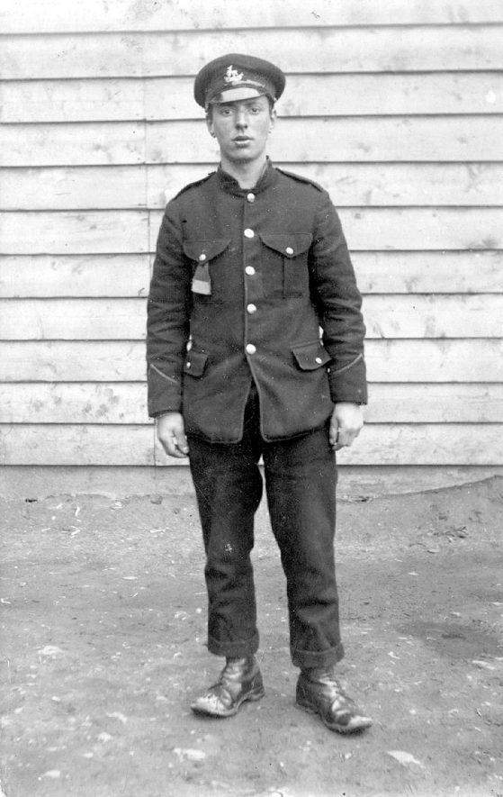 A First World War Prisoner of War minder wearing Royal Warwickshire's cap badge.  1910s [Image is of a Prisoner of War in Minden, Germany.] |  IMAGE LOCATION: (Warwickshire County Record Office)