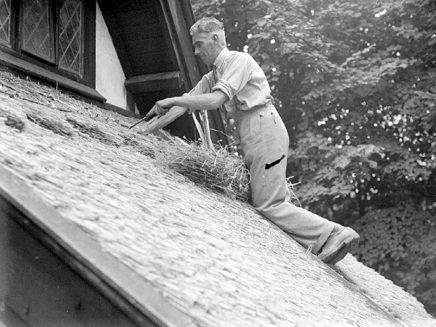 Mr H Hoggins thatching Bascote Heath Church.  11 August 1936 |  IMAGE LOCATION: (Warwickshire County Record Office) PEOPLE IN PHOTO: Hoggins, Mr H, Hoggins as a surname