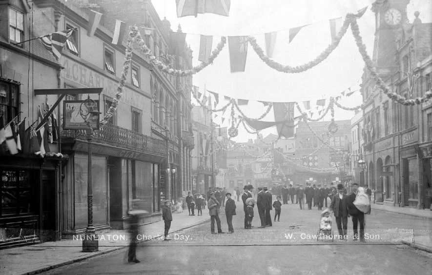Flags and bunting decorating the street at the Charter Day celebrations.  1907 |  IMAGE LOCATION: (Warwickshire County Record Office)