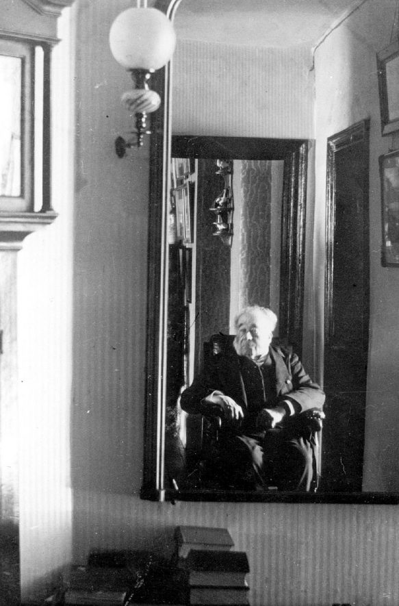 Rev. Hugh Bacon in Baxterley rectory.  1900s |  IMAGE LOCATION: (Warwickshire County Record Office) PEOPLE IN PHOTO: Bacon, Revd Hugh, Bacon as a surname