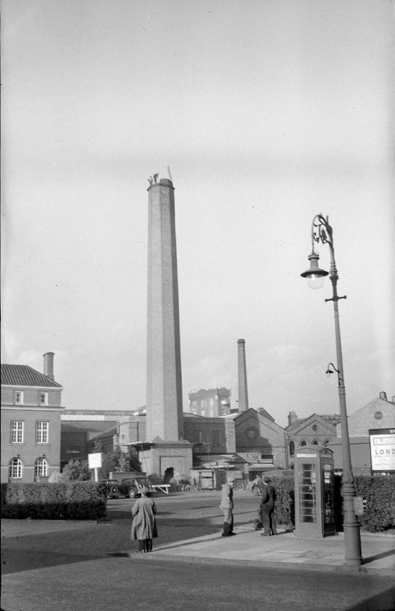 View from Coton Road of the demolition of electricity works chimney, near the Council House in Coton Road, Nuneaton.  1950 |  IMAGE LOCATION: (Warwickshire County Record Office)