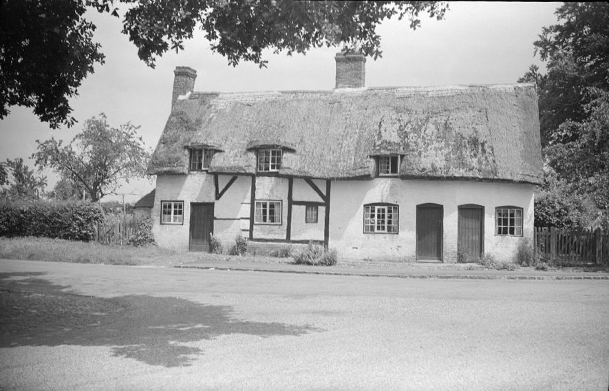 Two thatched cottages in the village of Monks Kirby.  1951 |  IMAGE LOCATION: (Warwickshire County Record Office)